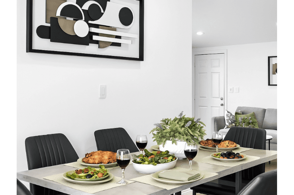 Dining table at Granada Assisted Living elegantly set with fresh meals, comfortable seating, and tasteful decor.